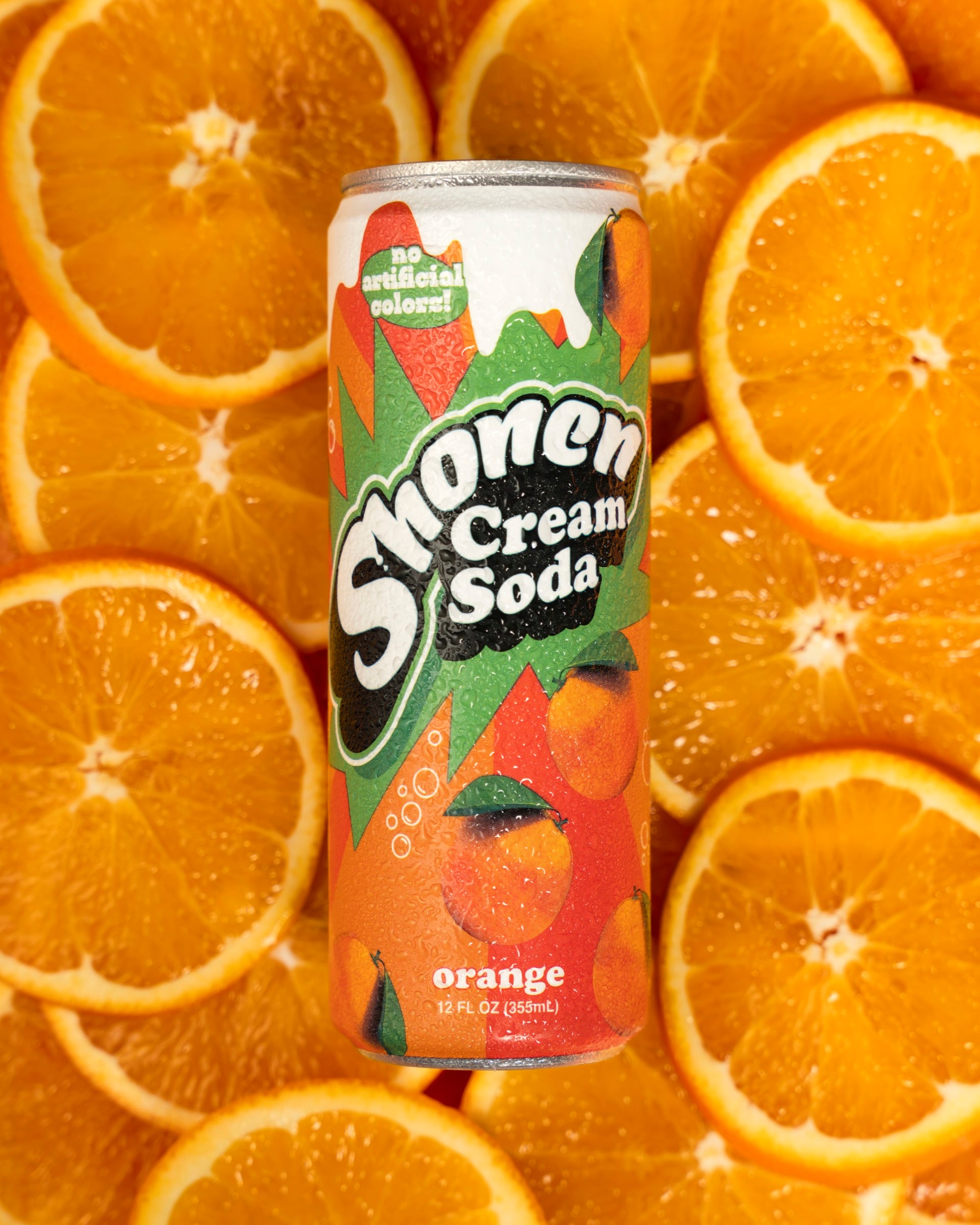 Shonen orange cream soda can resting on a bed of fresh orange slices