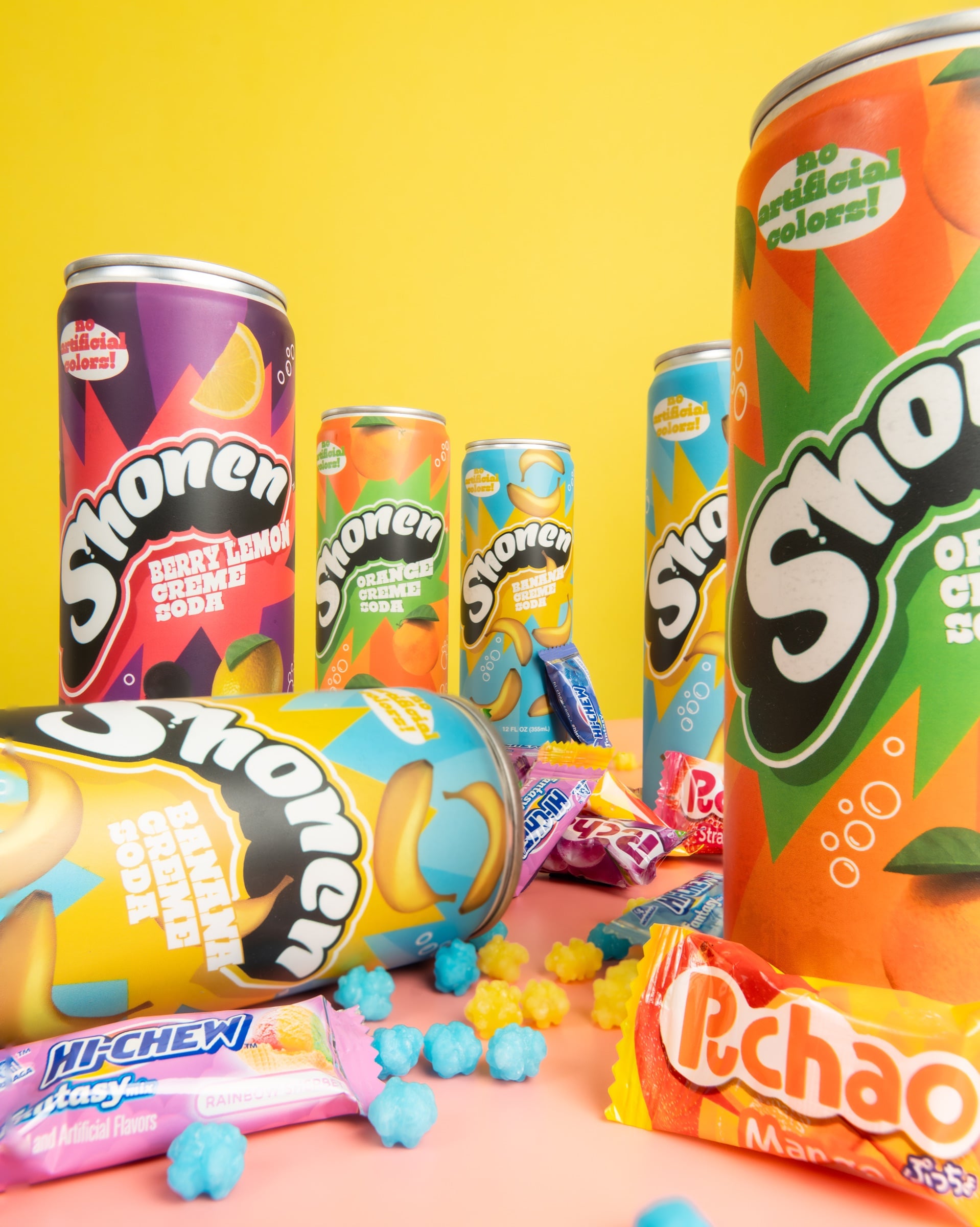 Colorful spread of Shonen cream soda flavors with Japanese candy on a bright backdrop