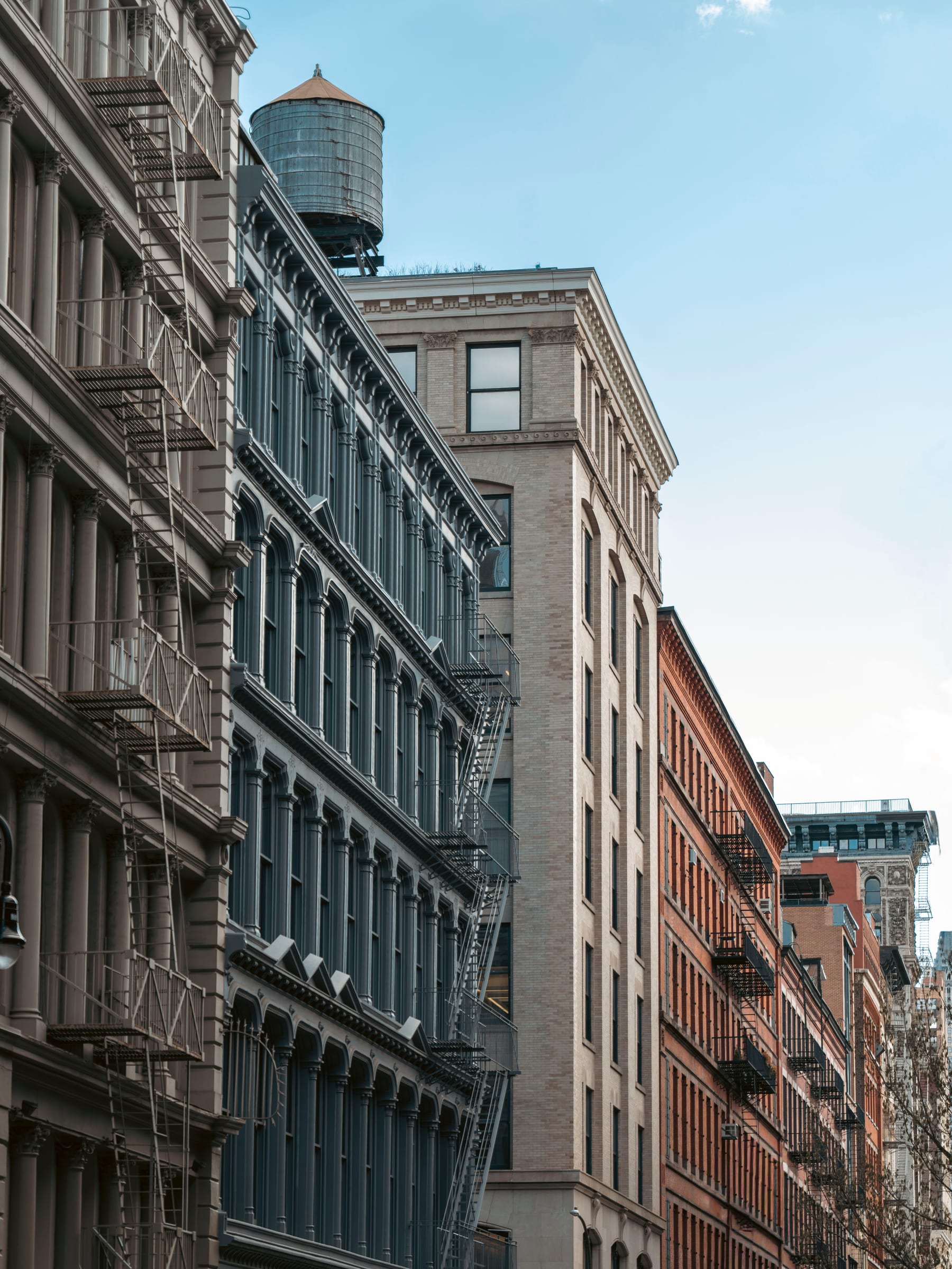 A rooftop water tower above SoHo cast-iron facades